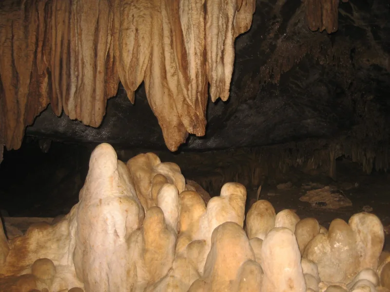Stalactites and stalagmites fill a limestone cave near Pu Luong. Stalactites and stalagmites fill a limestone cave near Pu Luong.