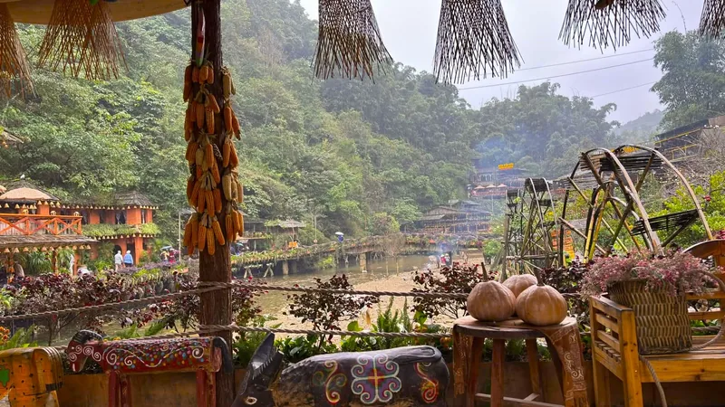 Waterwheels turn beside a stream at Cat Cat Village, framed by dried corn, pumpkins, and misty hills. Waterwheels turn beside a stream at Cat Cat Village, framed by dried corn, pumpkins, and misty hills.